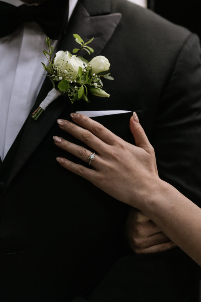 Ring shot against groom's suit