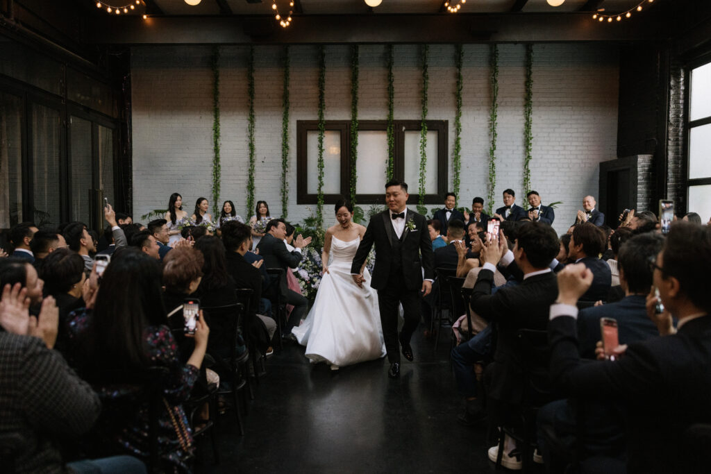Bride and groom walking back down the aisle