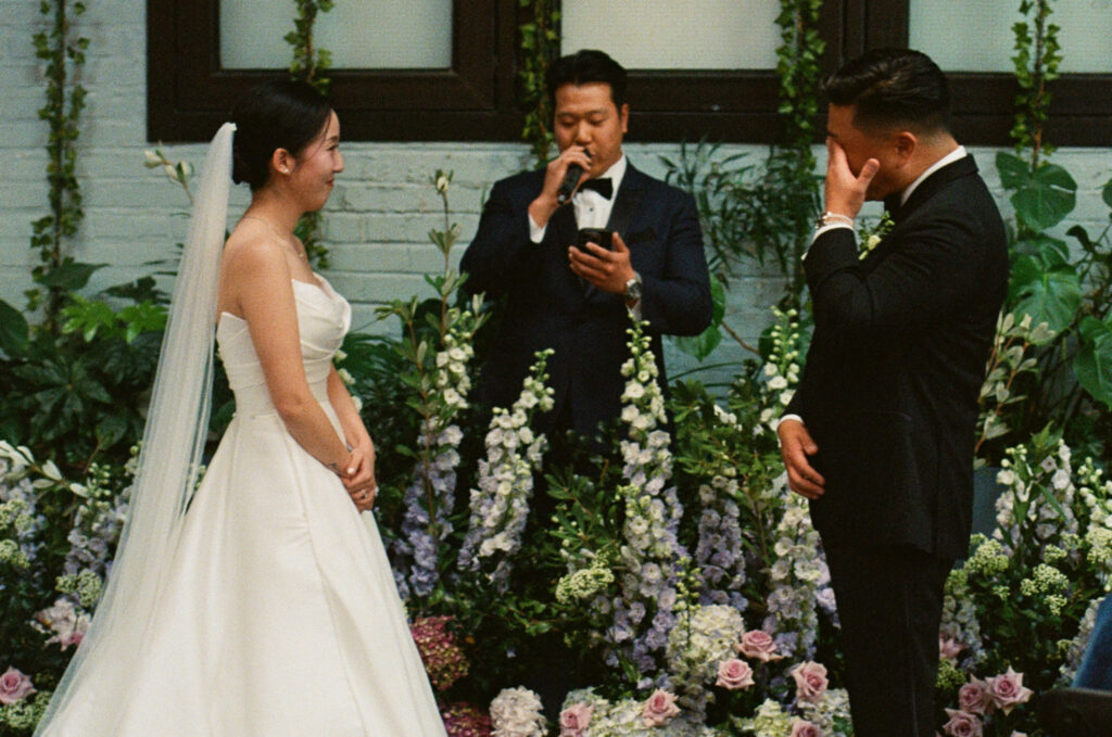Close up of bride and groom at the altar 