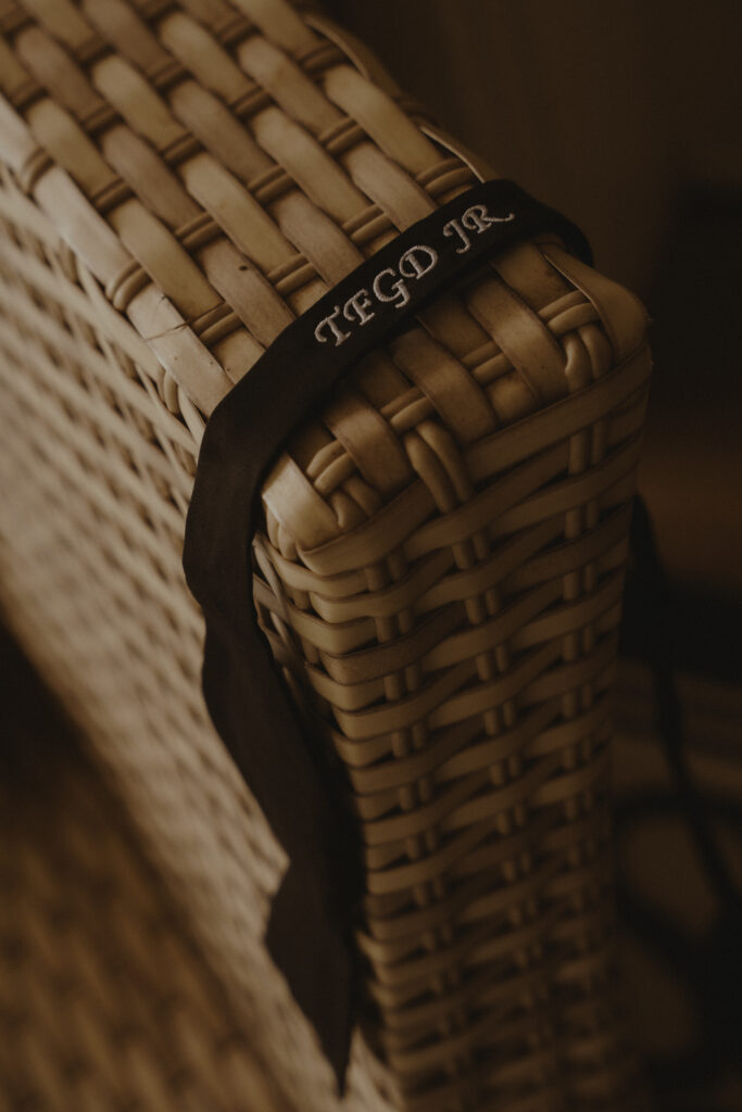 Detail shot of groom's monogrammed bow tie 