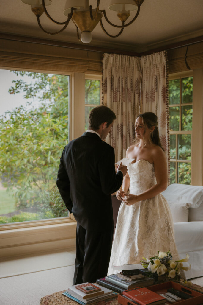Groom reading his vows to the bride during their private vows