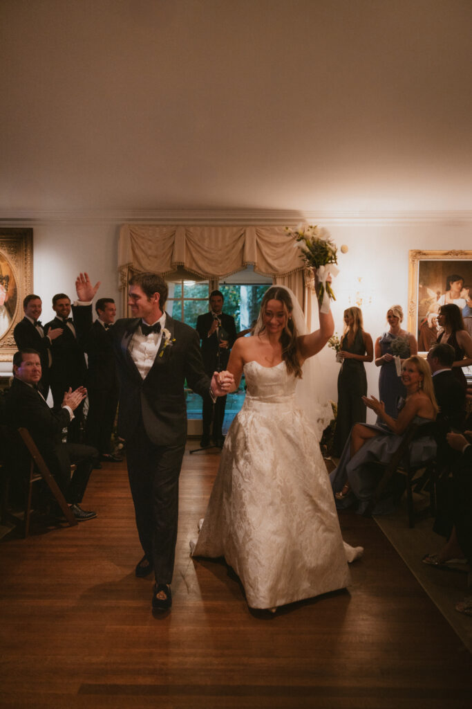 Bride and groom walking back down the aisle after getting married