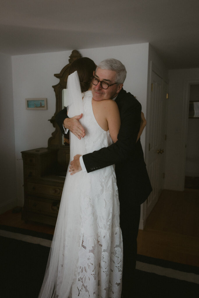 Bride hugging her father 