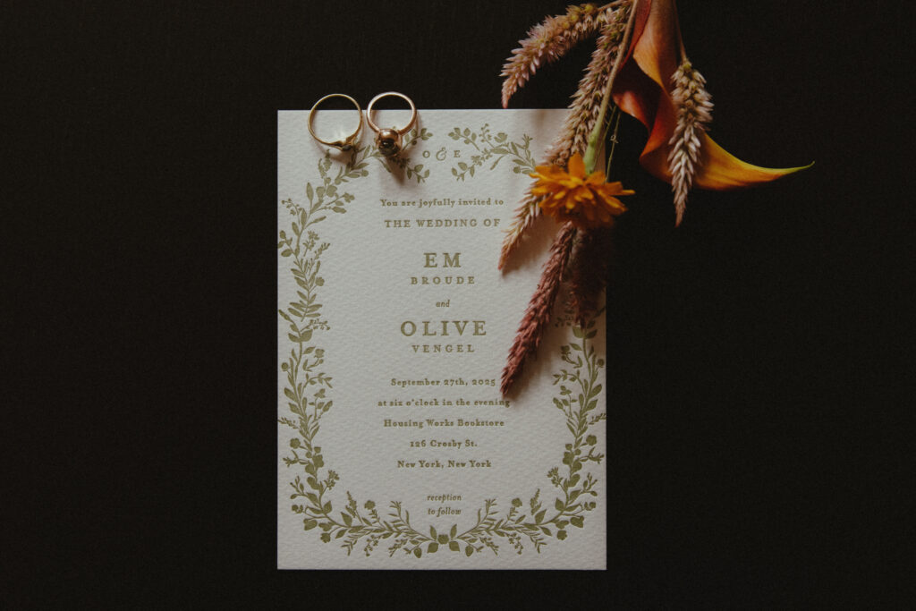 Wedding Invitation Detail with Wedding Rings and Autumnal Florals