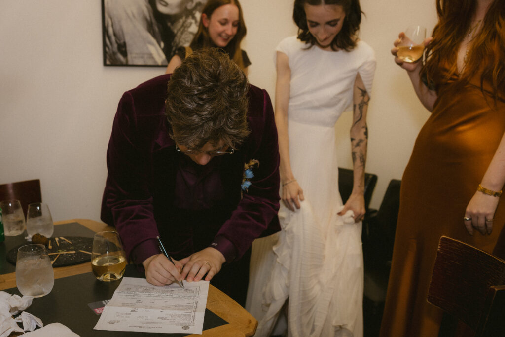 Bride signing the marriage license