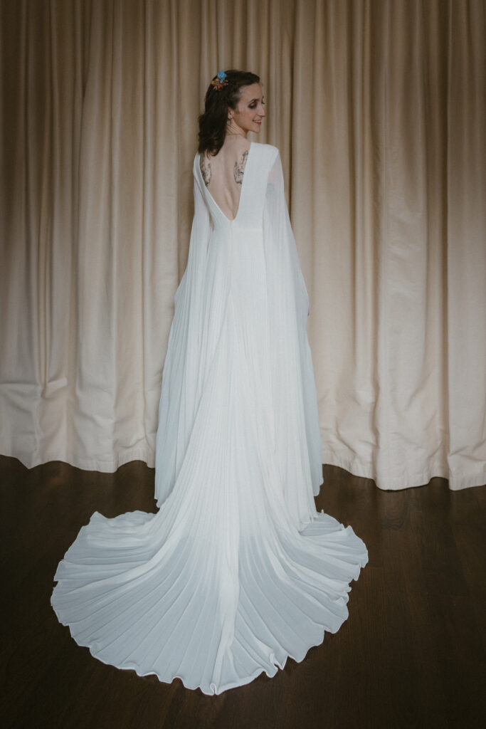 Bride in her wedding dress, taken from behind