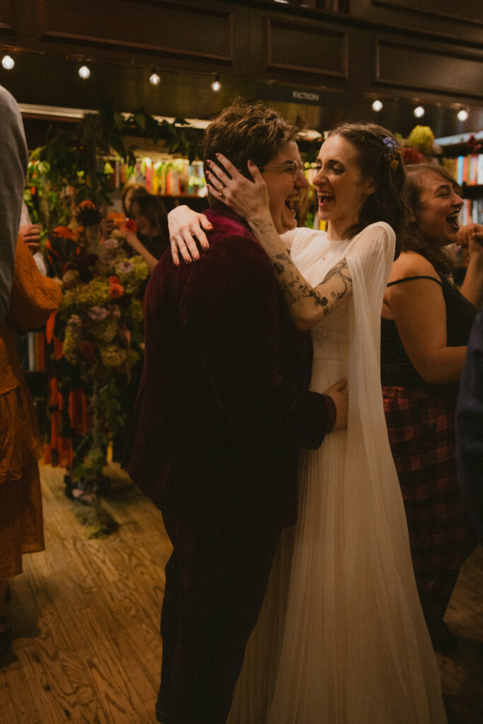 Brides laughing and dancing together