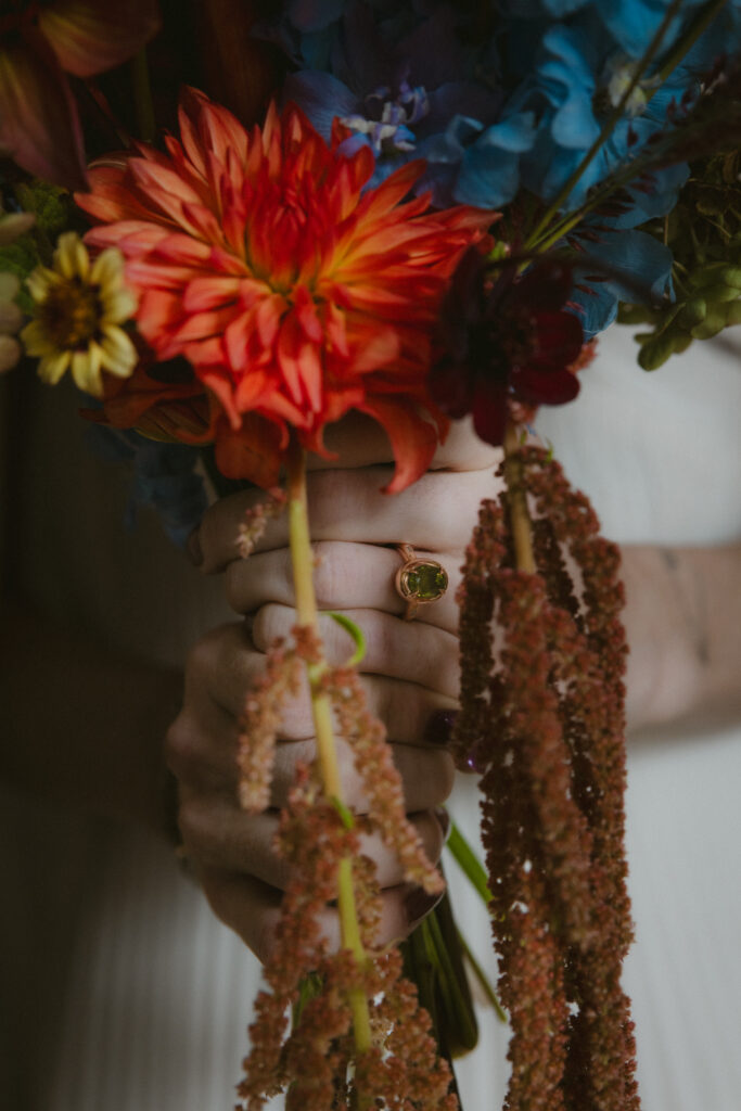 Close up of bride's bouquet and engagement ring 
