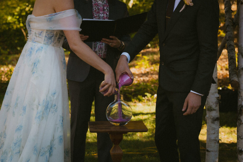 Bride and groom performing unity ceremony