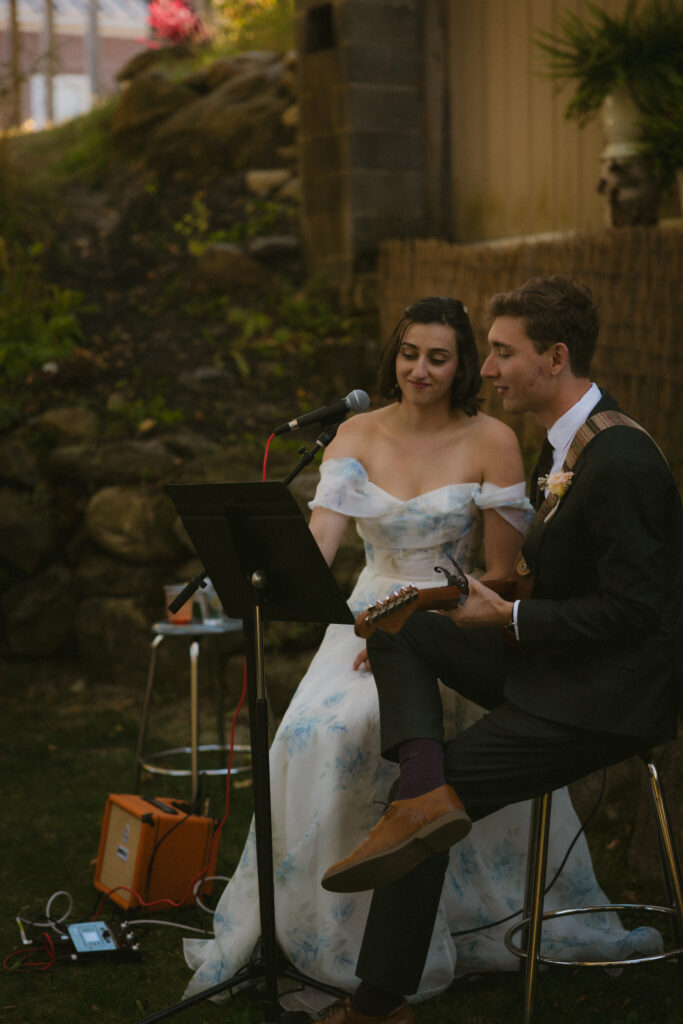 Bride and groom performing a musical number during the reception