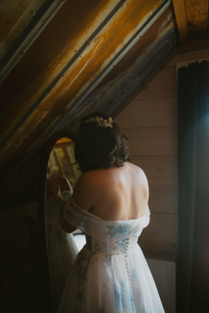 Bride getting ready in front of a mirror