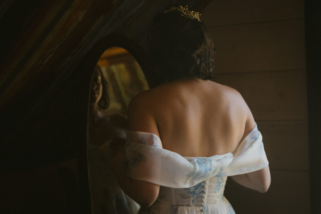 Bride getting ready in front of the mirror