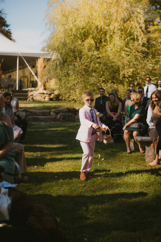 "Flower Girl" throwing petals while walking down the aisle
