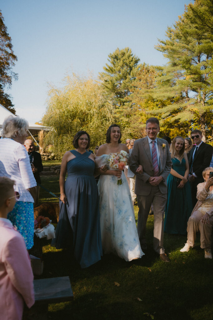 Bride walking down the aisle with her parents