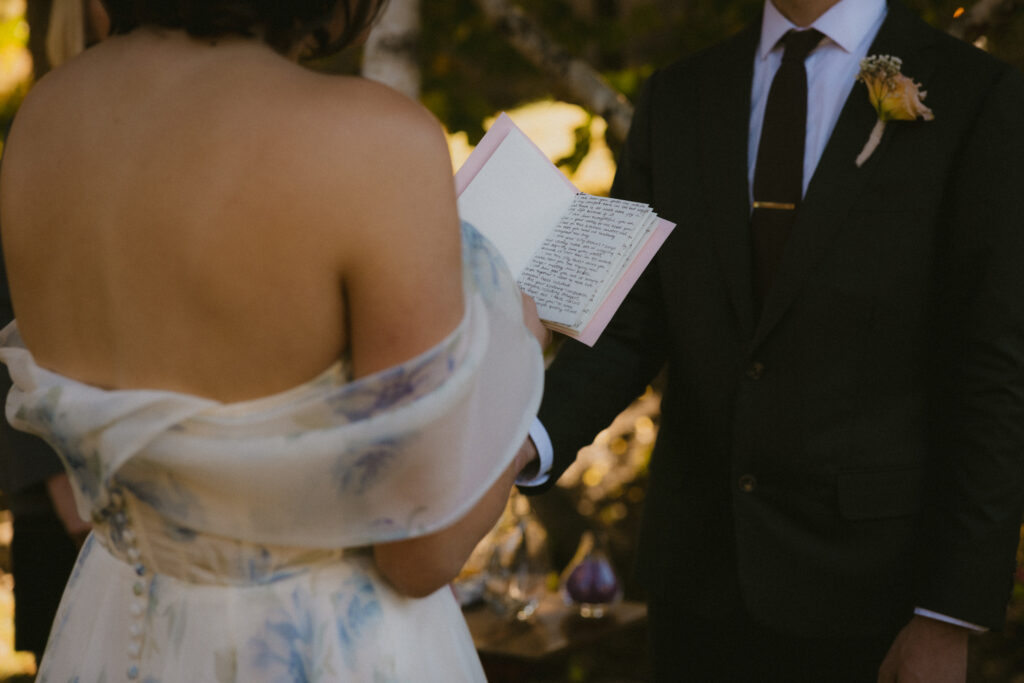 Close up of bride reading her vows during the ceremony