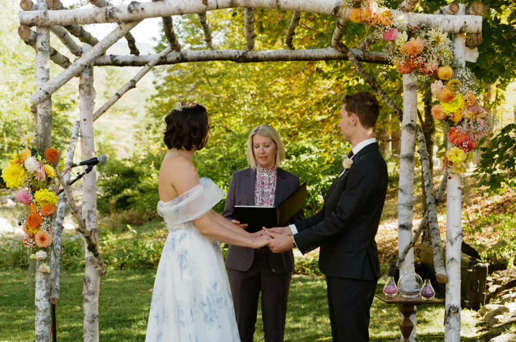 Bride and groom holding hands during the wedding ceremony