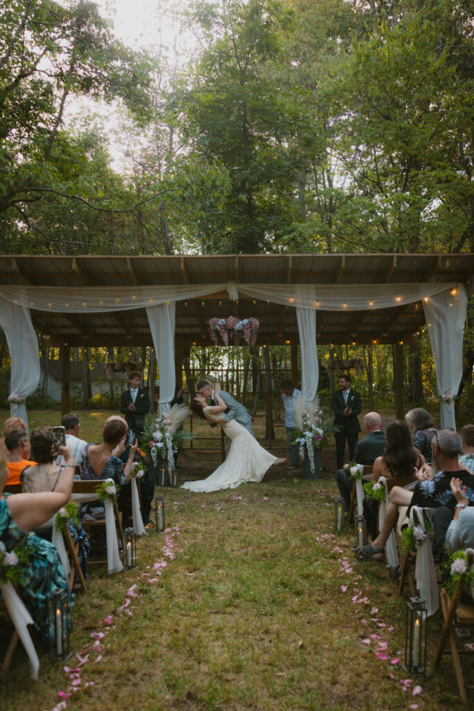 Bride and groom sharing their first kiss as husband and wife 