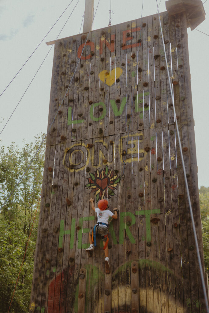Rock wall at a summer camp wedding venue