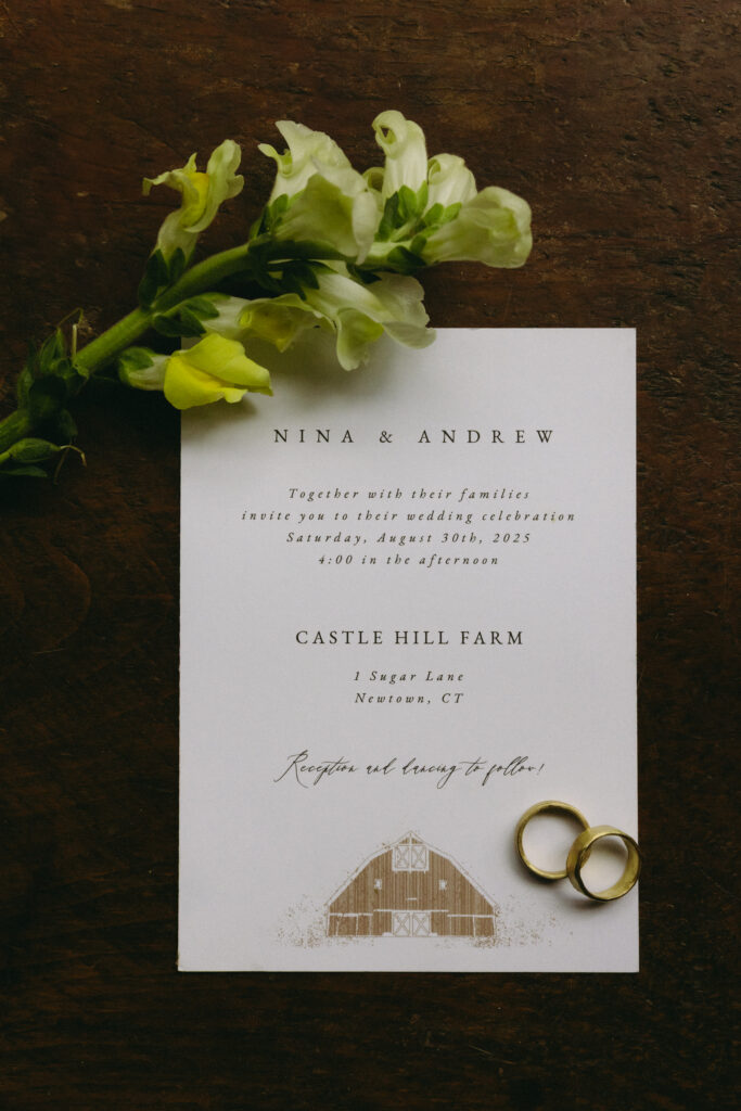 Wedding invitation flatlay for a New England farm wedding