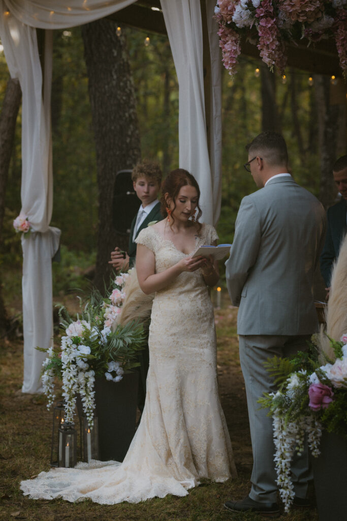Bride reading her vows during the wedding ceremony