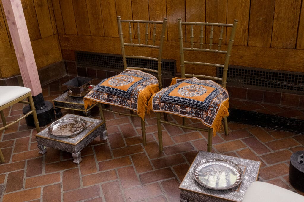 Bride and groom's seats during the ceremony at a Hindu Jewish wedding