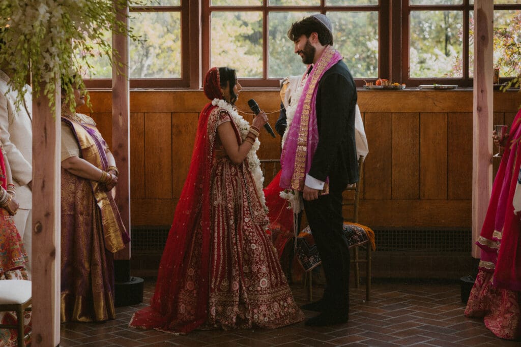 Bride and groom reading their chosen poems during the wedding ceremony