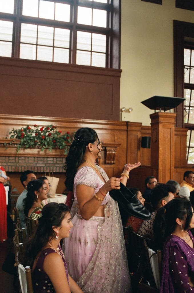 Bride's family negotiating with the groom to return his shoes