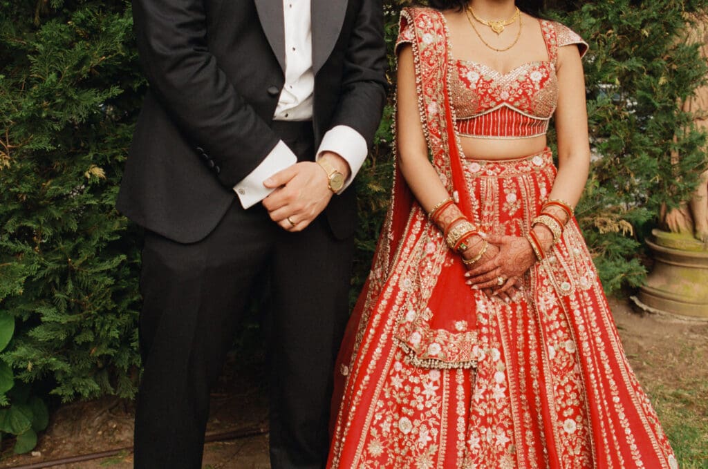 Close up of the bride and groom's outfits 