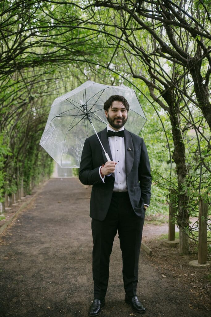 Groom waiting for the bride at the first look location