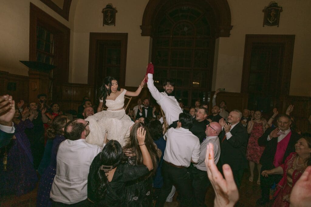 Bride and groom doing the hora
