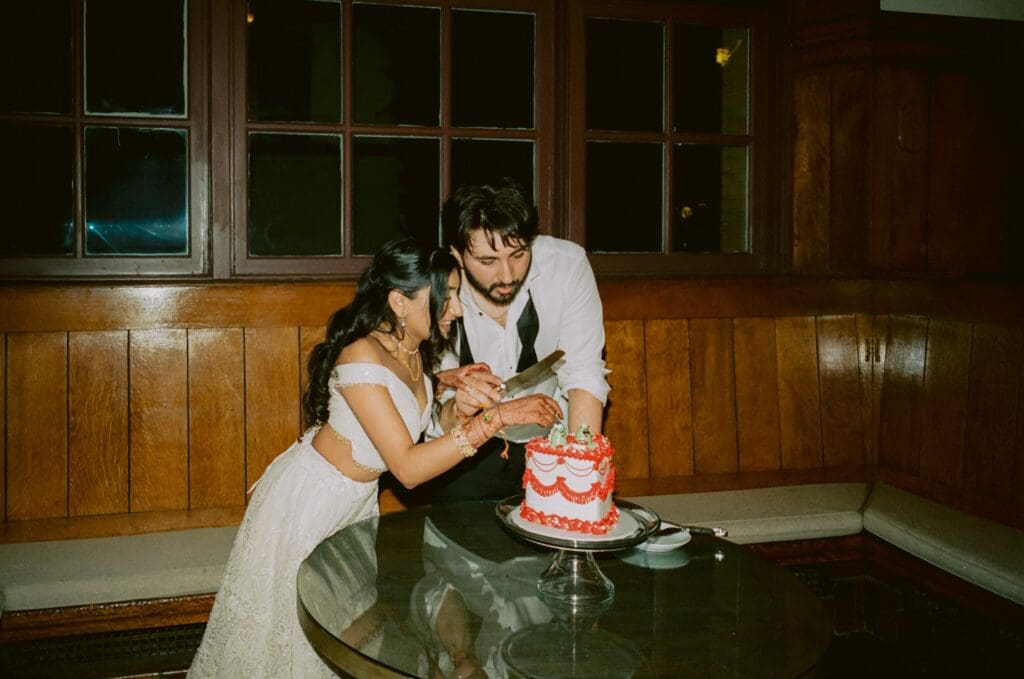 Bride and groom cutting the cake
