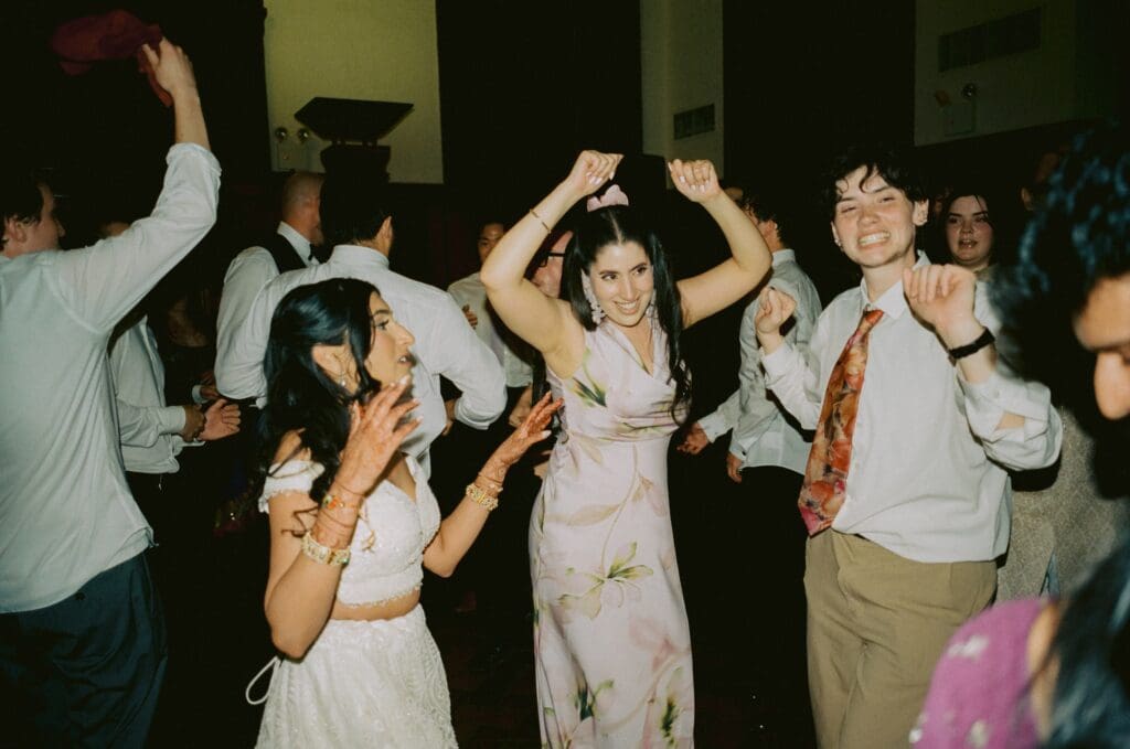 Wedding guests and bride on the dance floor