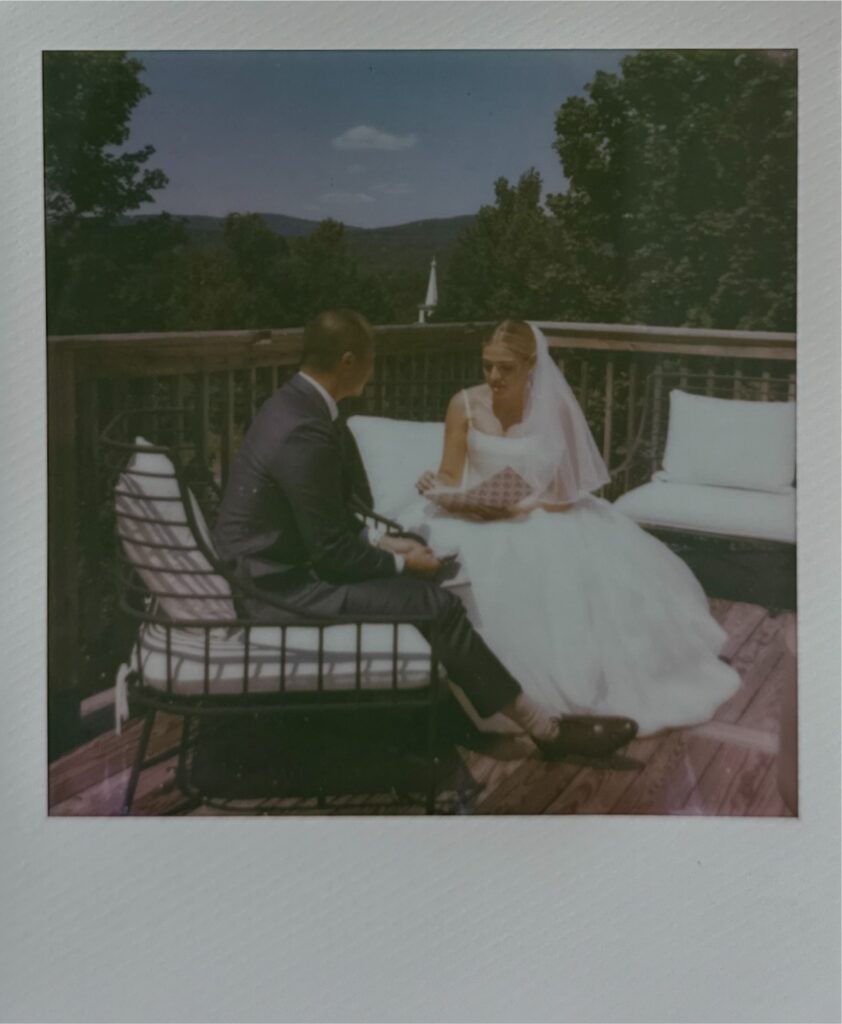 Polaroid of the bride and groom saying private vows