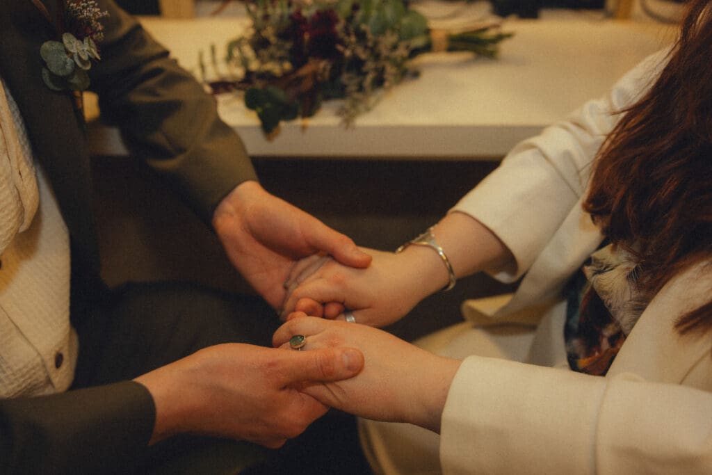 Couple holding hands at their manhattan city hall elopment