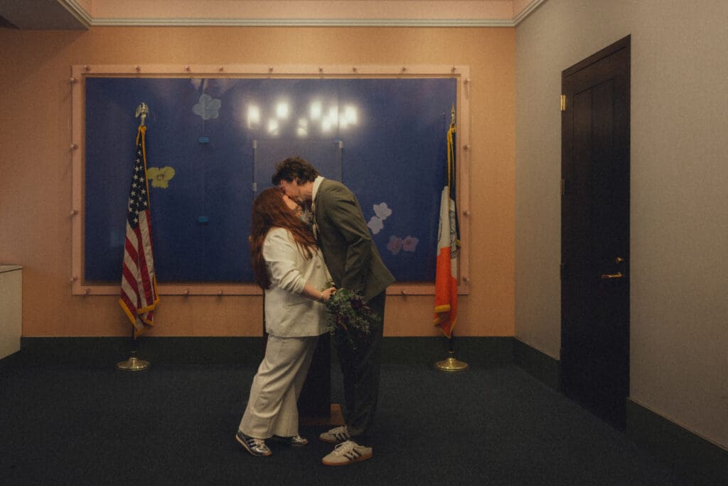 Couple sharing their first kiss as a married couple at their manhattan city hall elopement