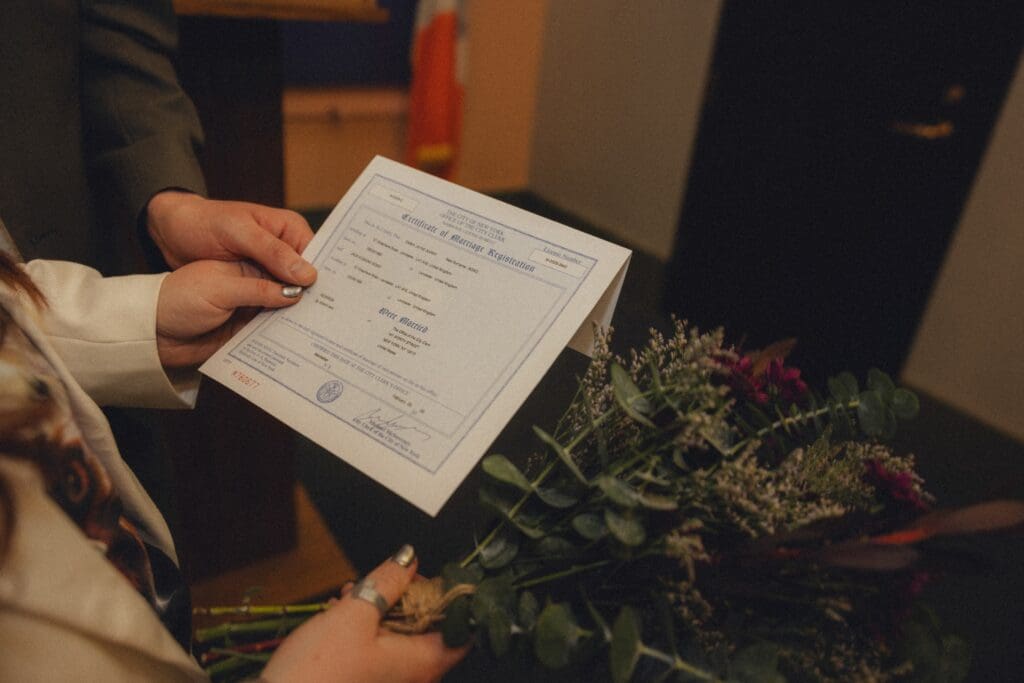 Couple looking at their new marriage certificate