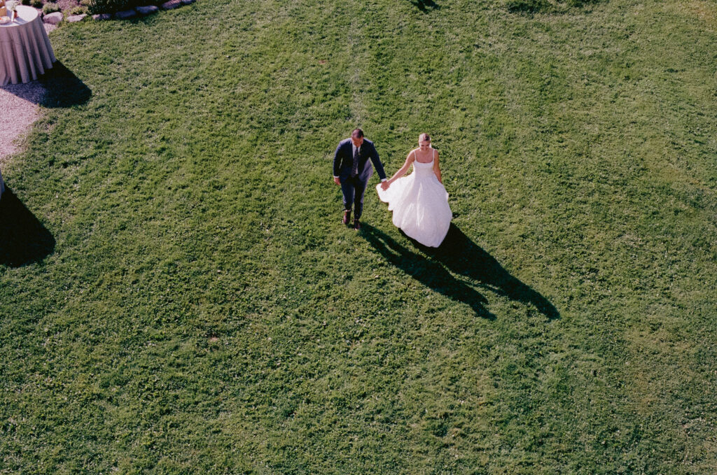Bride and groom walking out after the ceremony, shot from above