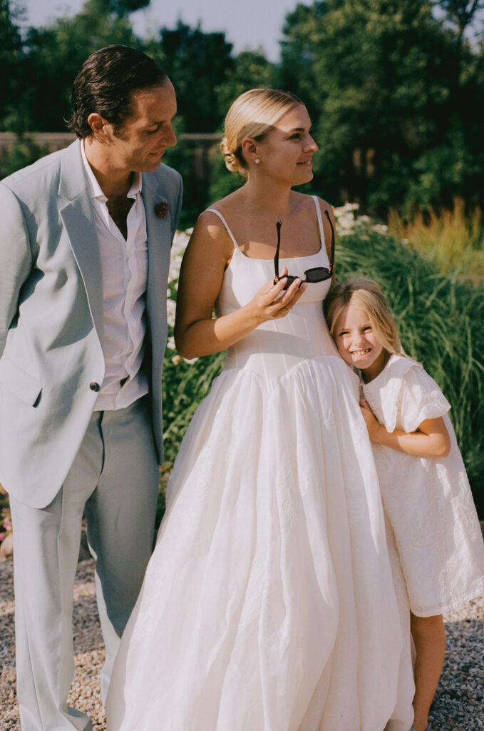Bride with wedding guests during cocktail hour