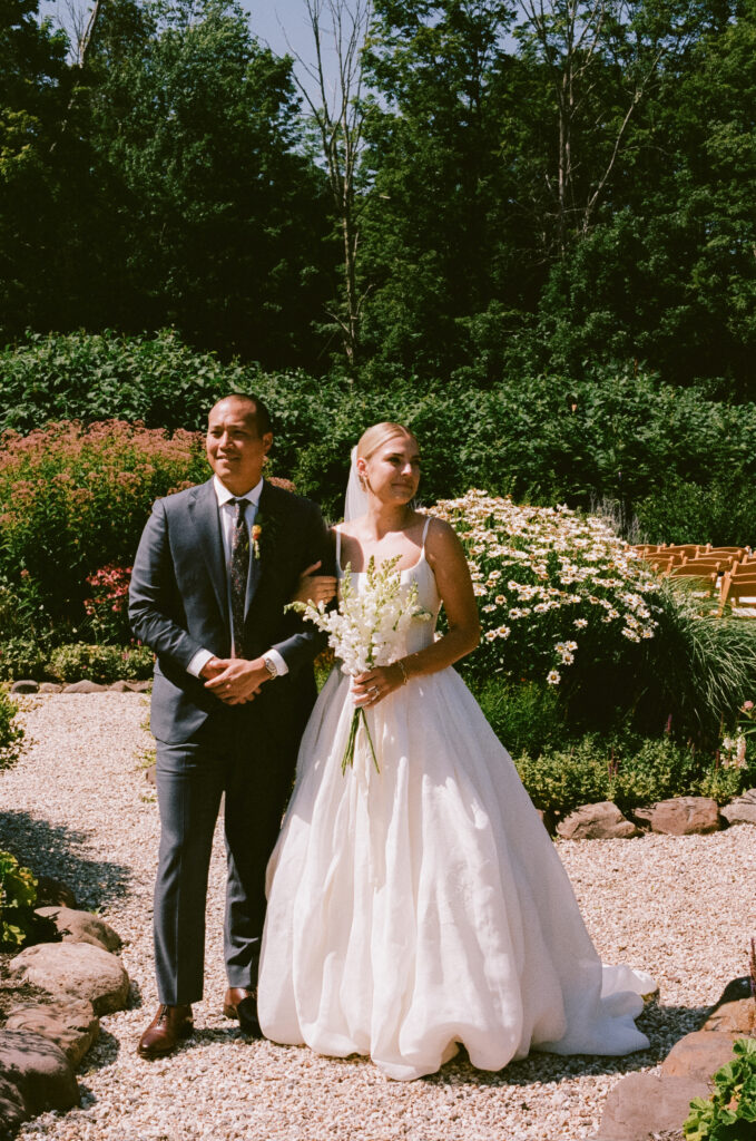 Bride and groom portrait in a flower garden
