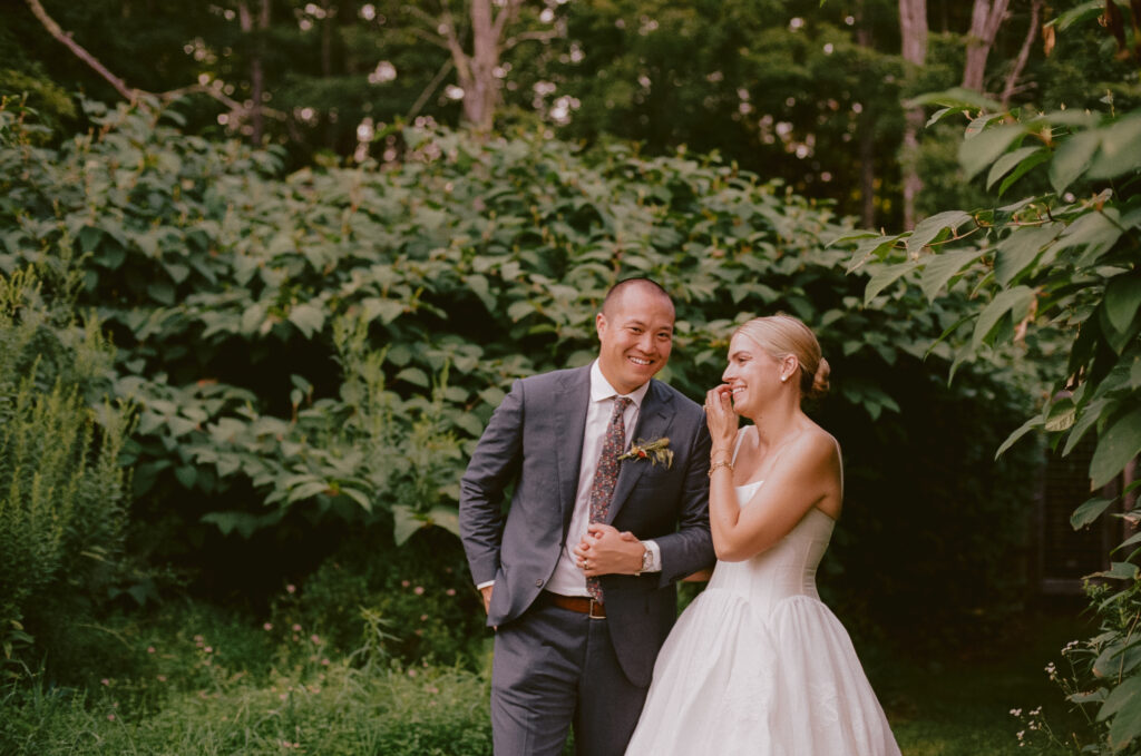 Bride and groom laughing together