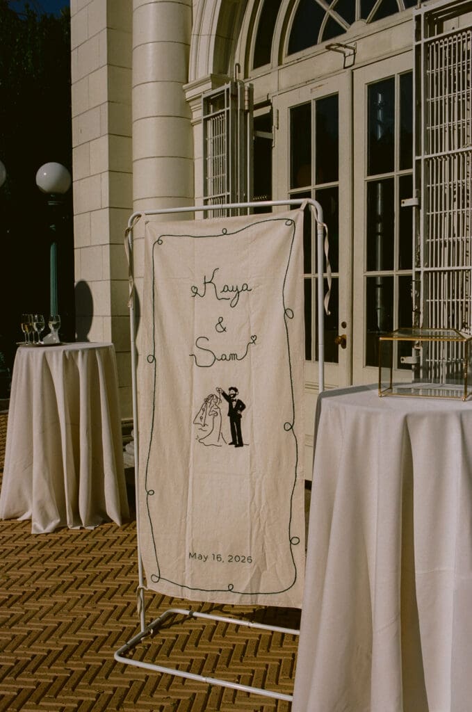 Custom branded embroidered canvas banner with the bride and groom's names and wedding date