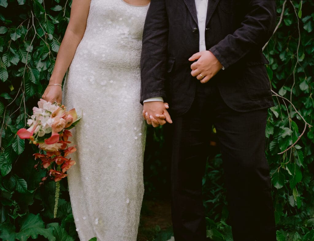 Close up of the bride and groom's wedding outfits at their prospect park boathouse wedding