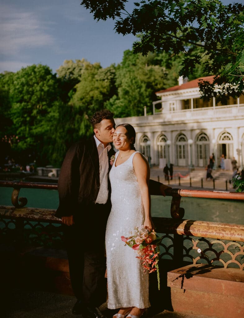 Bride and groom portraits on the bridge across from the prospect park boathouse