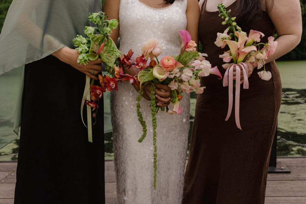 Close up of the bride and bridesmaids with their bouquets