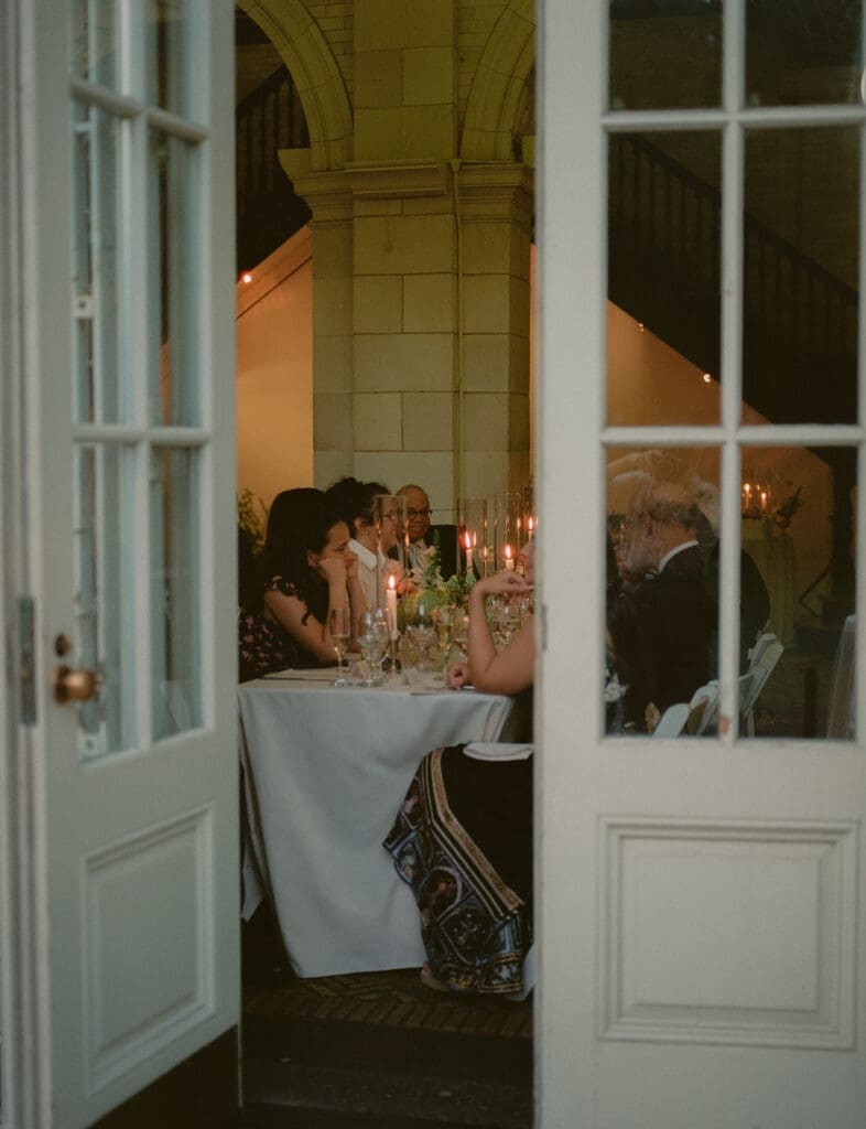 Reception dinner at the prospect park boathouse, taken through the doors from outside