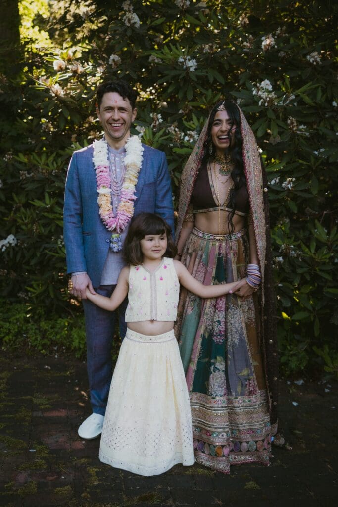 Portrait of the bride, groom, and child