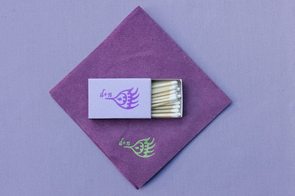 Custom wedding branded purple napkins and matchboxes
