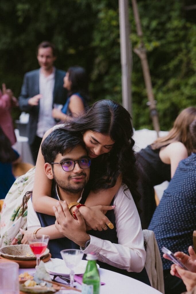 Bride hugging a wedding guest during the reception