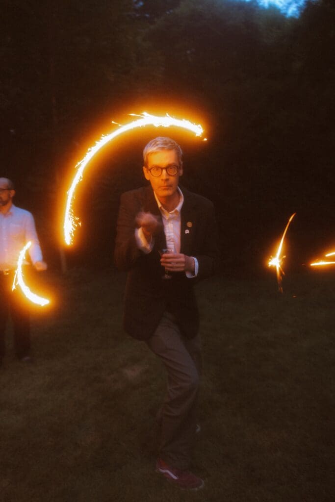 Wedding guest with a sparkler during the reception