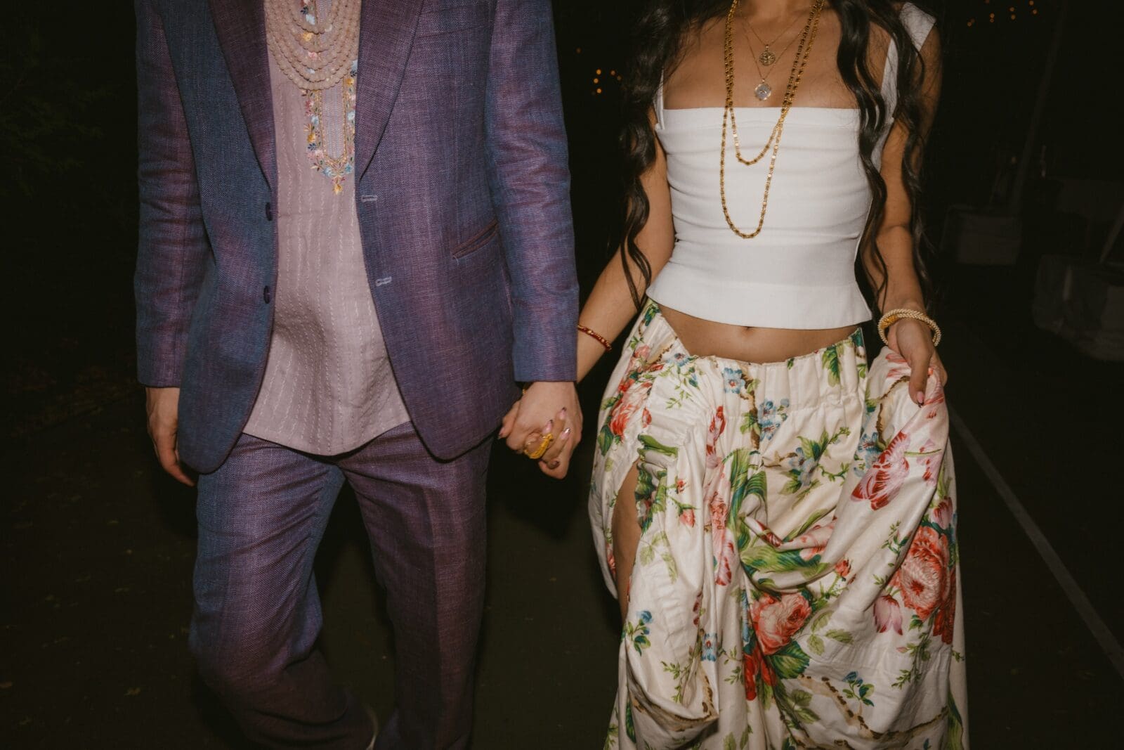 Close up of the bride and groom's late night outfits 